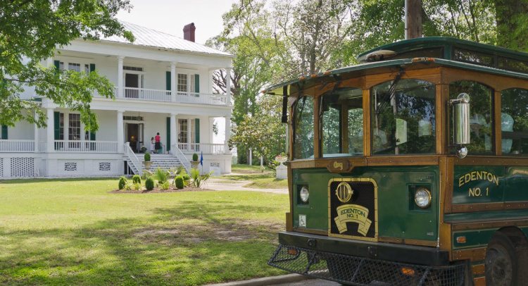 The Edenton No. 1 trolley on a historic tour past a colonial home